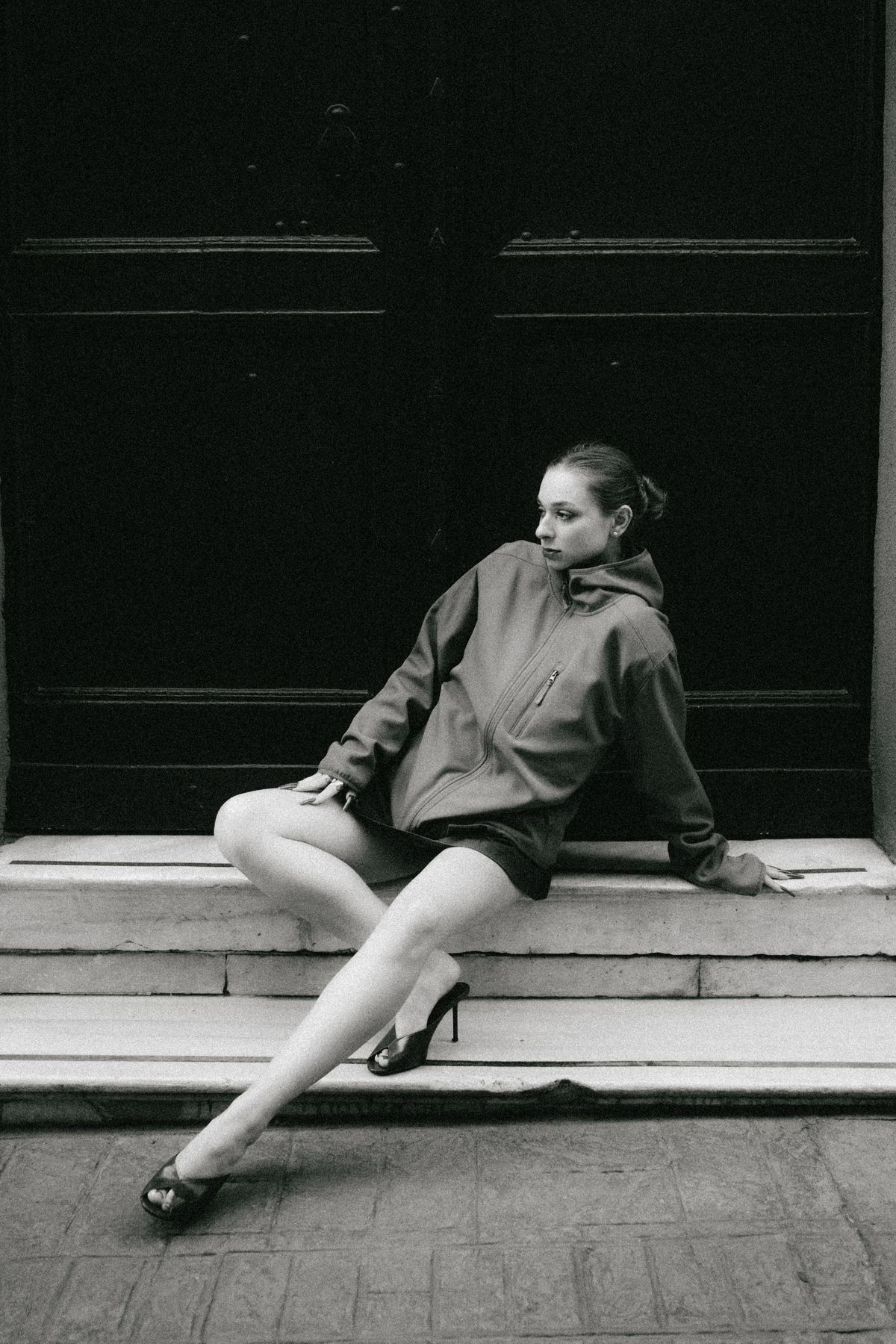 A stylish woman on the steps — the considered return of the heel