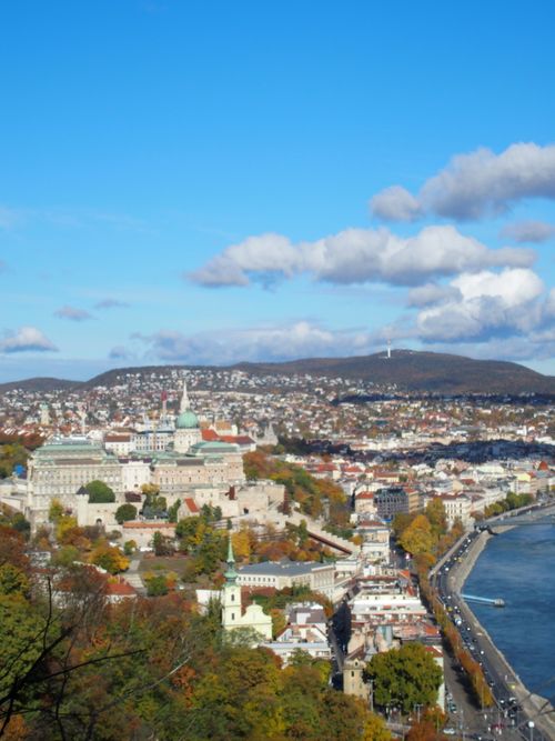 Free Stunning aerial view of Budapest featuring the iconic Buda Castle and the Danube River in autumn. Stock Photo