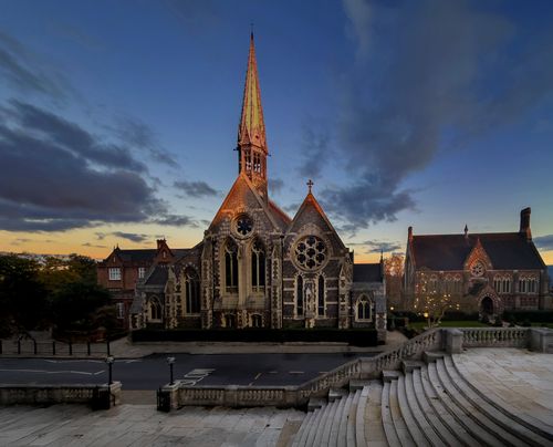 Free Twilight view of the historic Harrow School Chapel in London with dramatic sky. Stock Photo