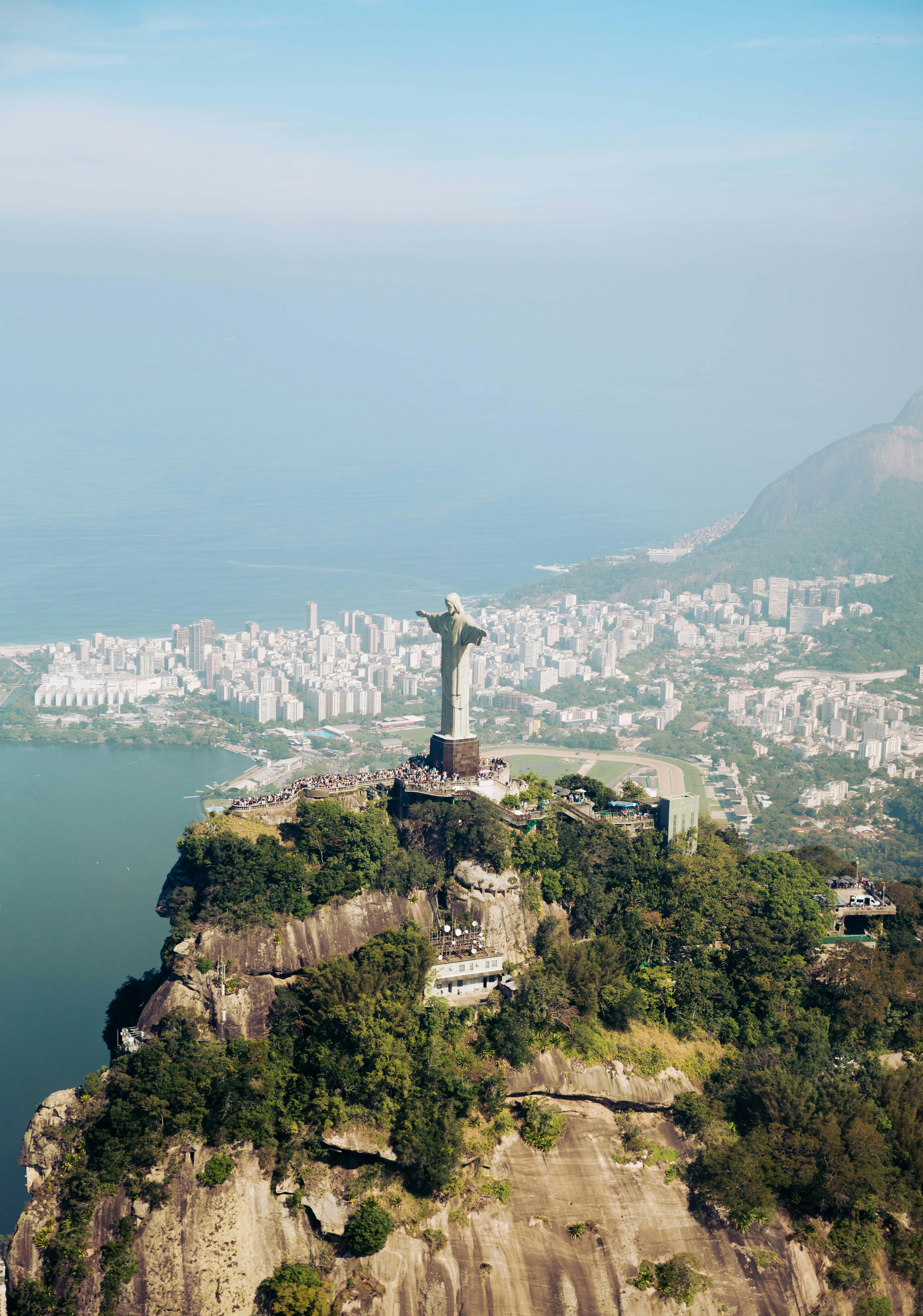 Stunning aerial shot of Christ the Redeemer overlooking Rio de Janeiro's cityscape.