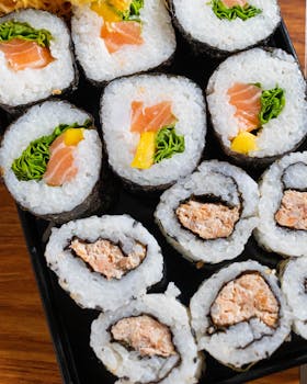 A delicious platter of assorted sushi rolls featuring salmon, seaweed, and rice, perfect for sushi lovers.