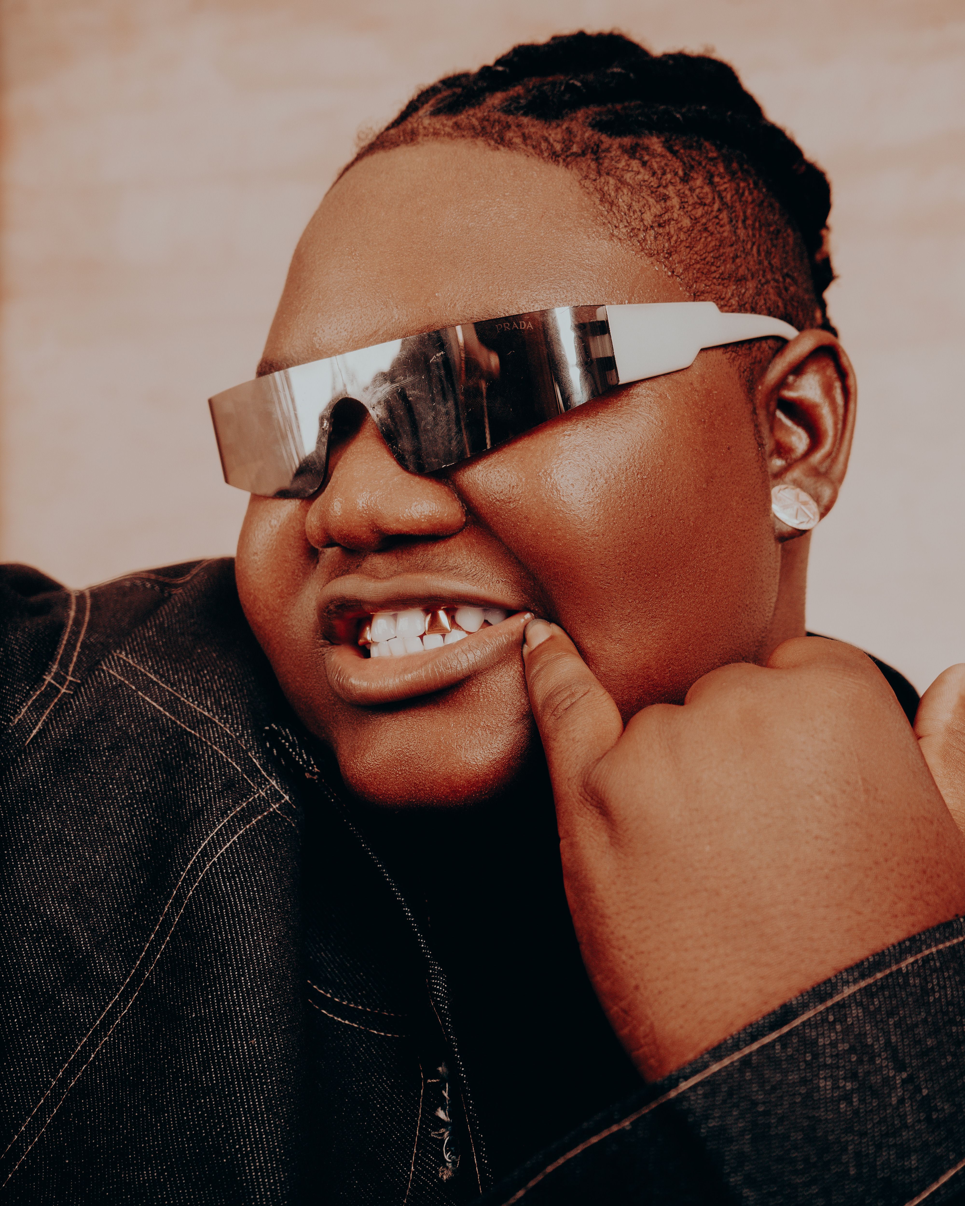 Captivating portrait of a person wearing sunglasses, exuding style and confidence in a modern setting.