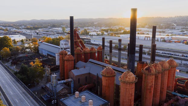 Aerial view of historic Sloss Furnaces at sunrise in Birmingham, Alabama, showcasing industrial heritage.