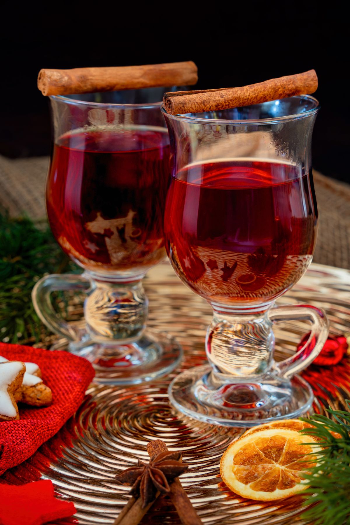 Warm mulled wine with cinnamon sticks for winter