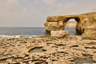 Scenic view of the Azure Window rock arch in Gozo, Malta with the Mediterranean Sea.