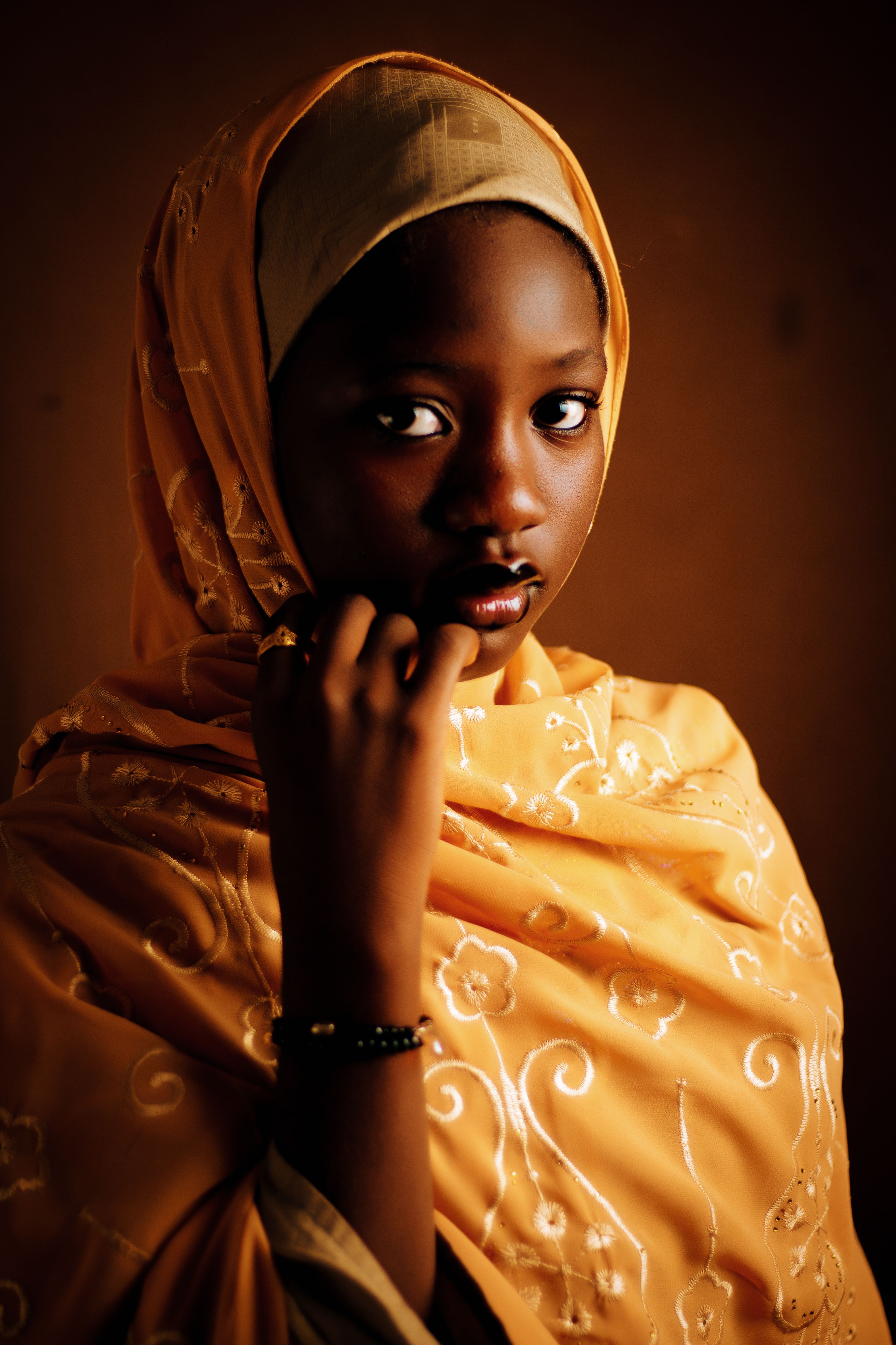Portrait of a Young Woman in a Yellow Hijab · Free Stock Photo