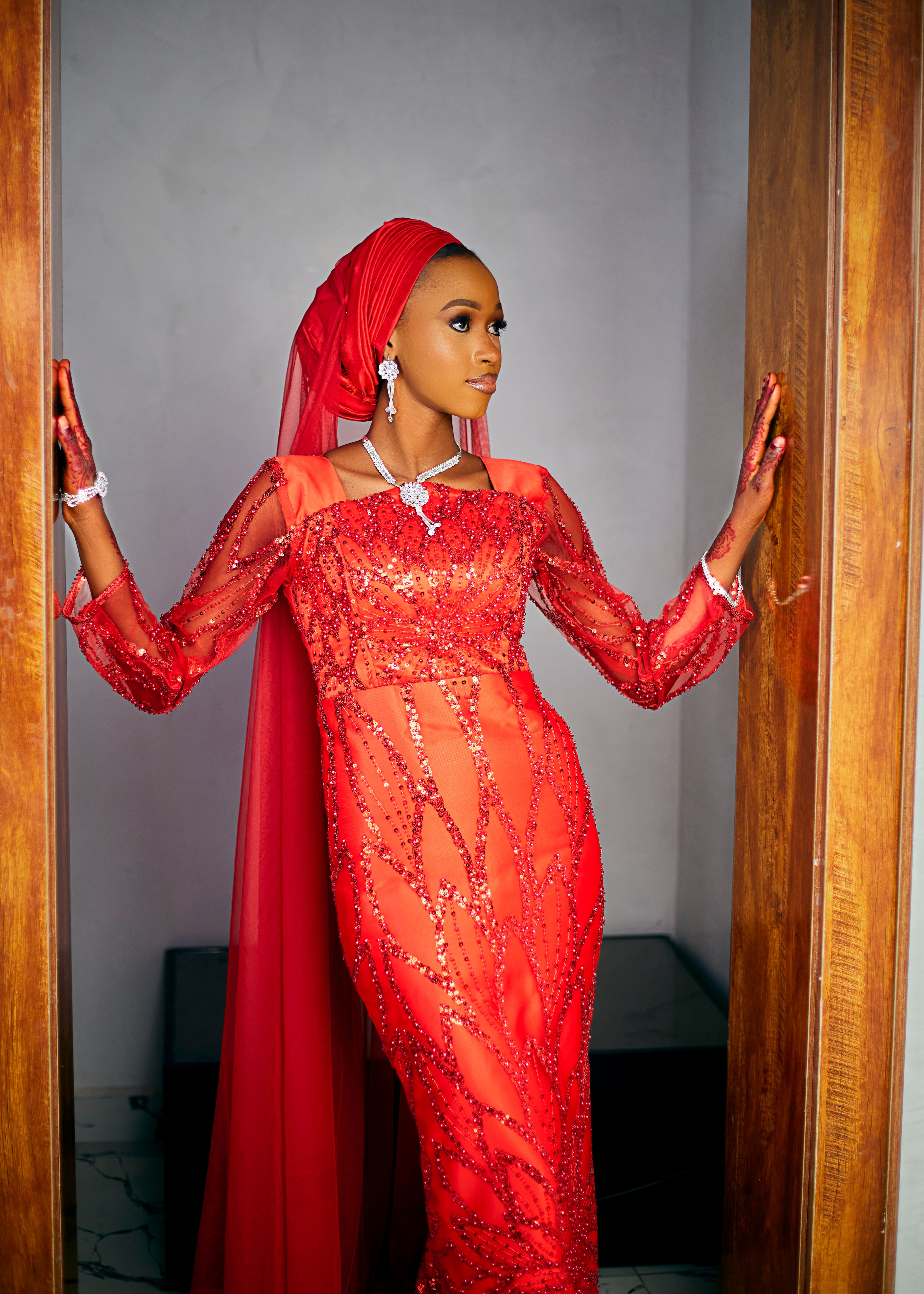 Elegant Woman in Vibrant Red Traditional Dress · Free Stock Photo