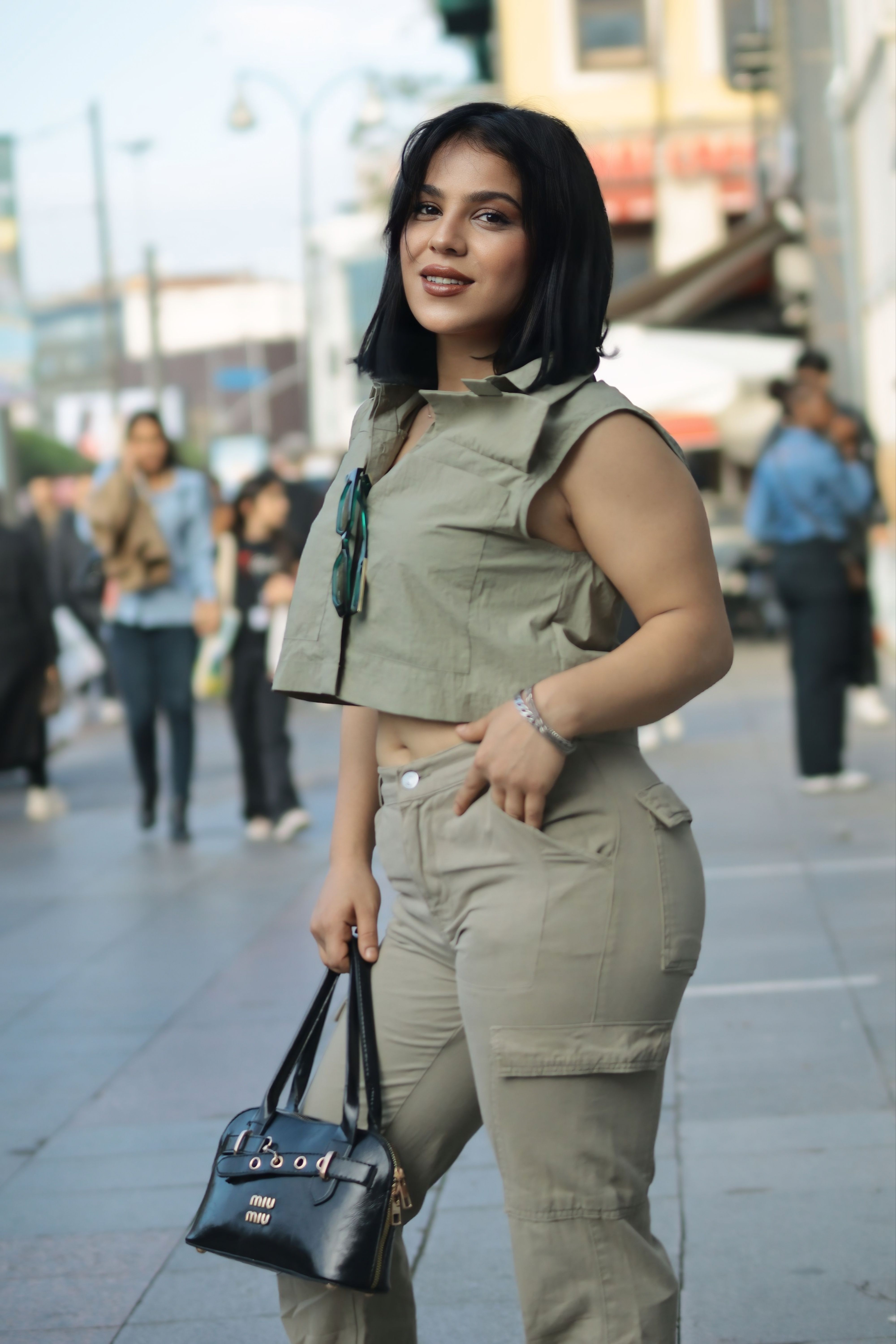 Stylish Woman Posing in Urban Street Setting · Free Stock Photo