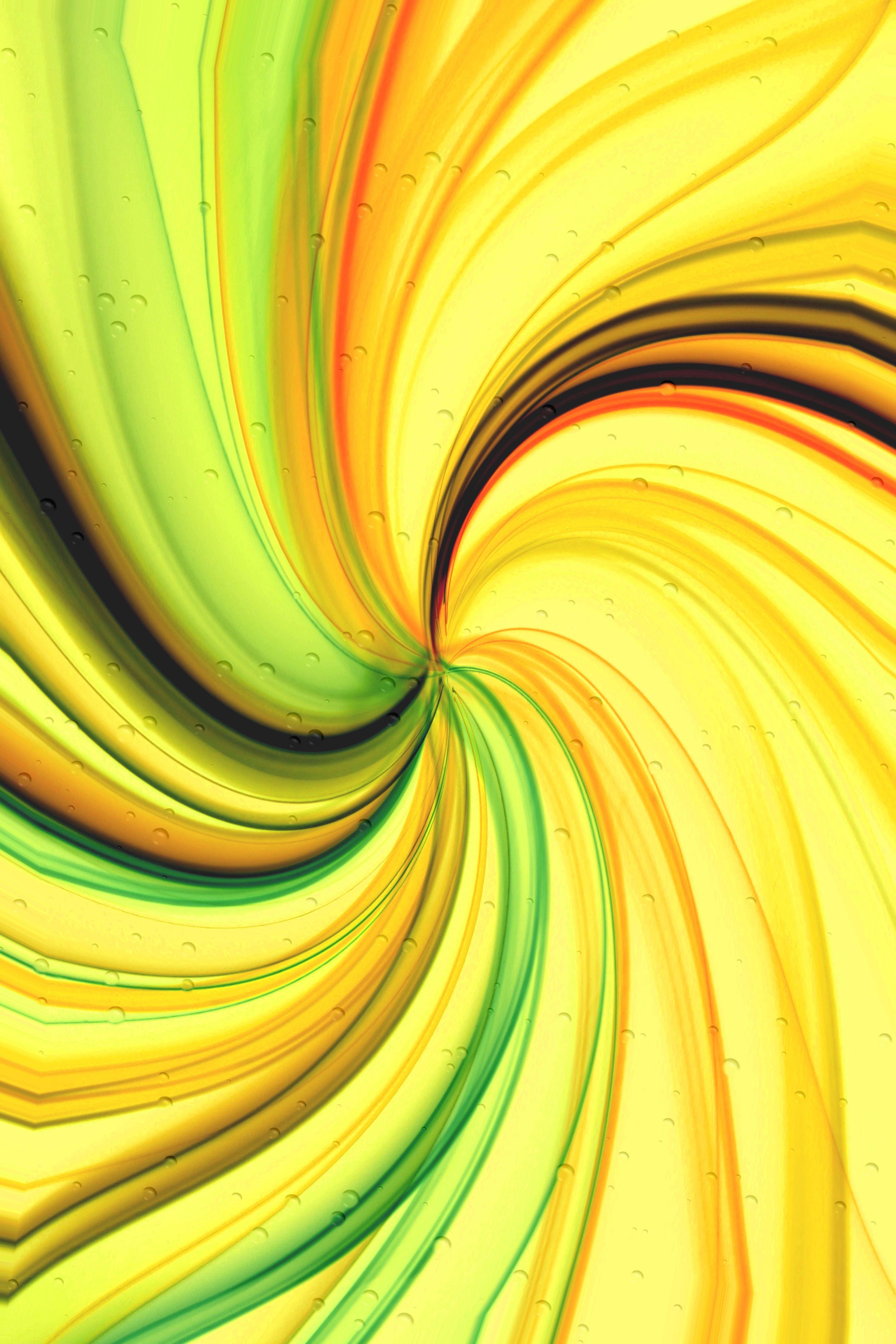 An abstract swirl of vibrant yellow and green colors with subtle textures and bubbles.