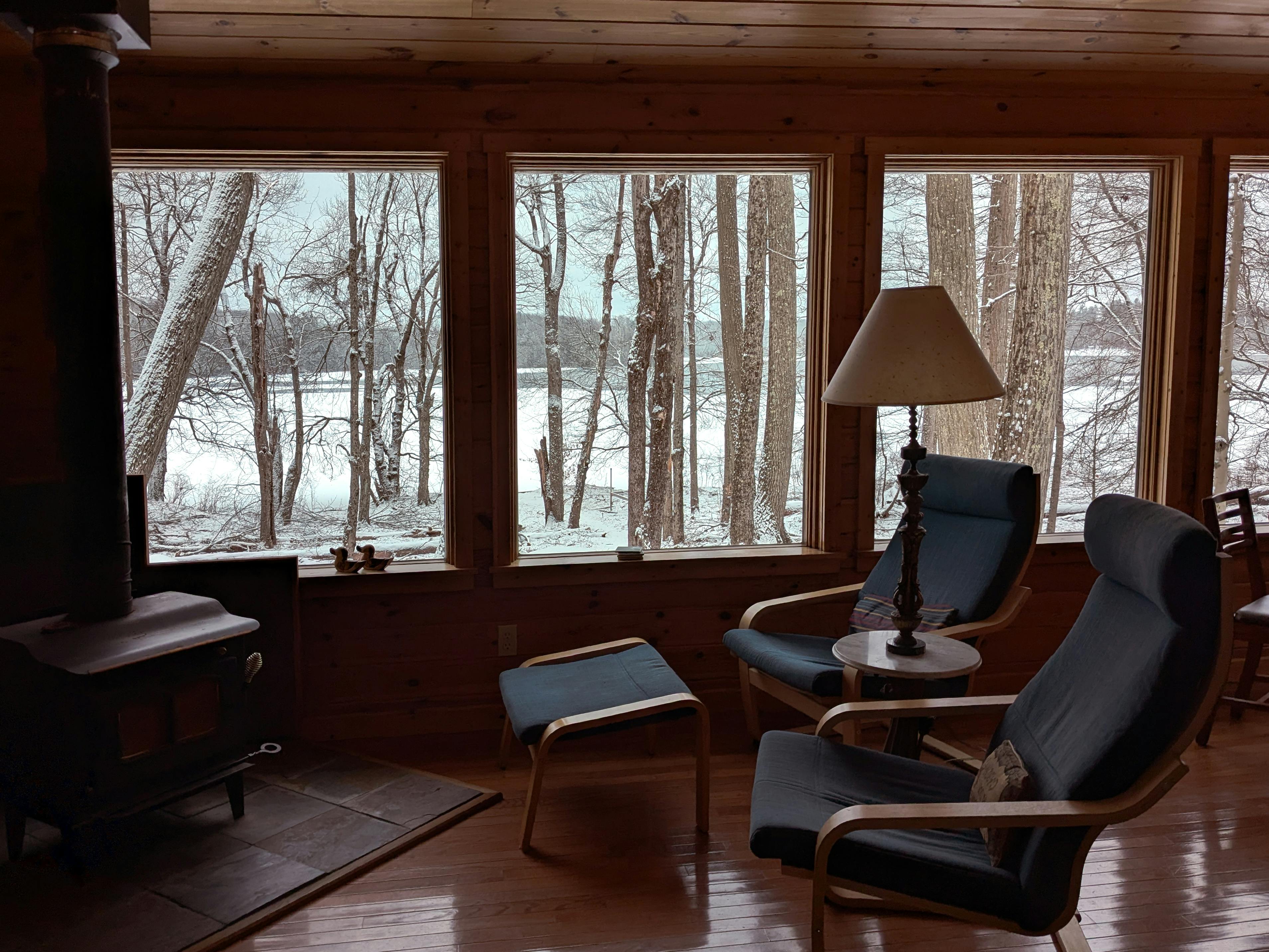 cozy living room with snow outside window - affordable heating installation in bethel park, pa