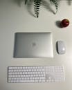 Minimalist Workspace with Apple Laptop and Keyboard