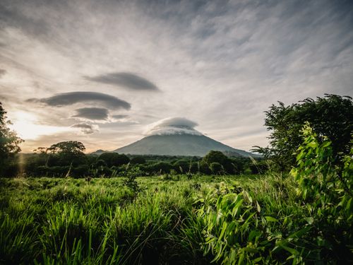 Free Majestic view of Volcano Concepcion under a cloudy sky with lush greenery in Rivas, Nicaragua. Stock Photo