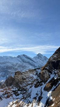 Majestic snowy peaks of the Swiss Alps under a clear blue sky in Lauterbrunnen, Switzerland.