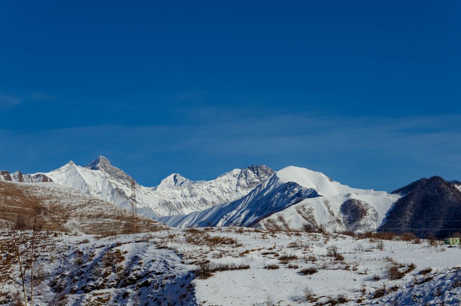 Skiers enjoying the slopes in Gudauri, Georgia, highlighting the need for adventure sports coverage