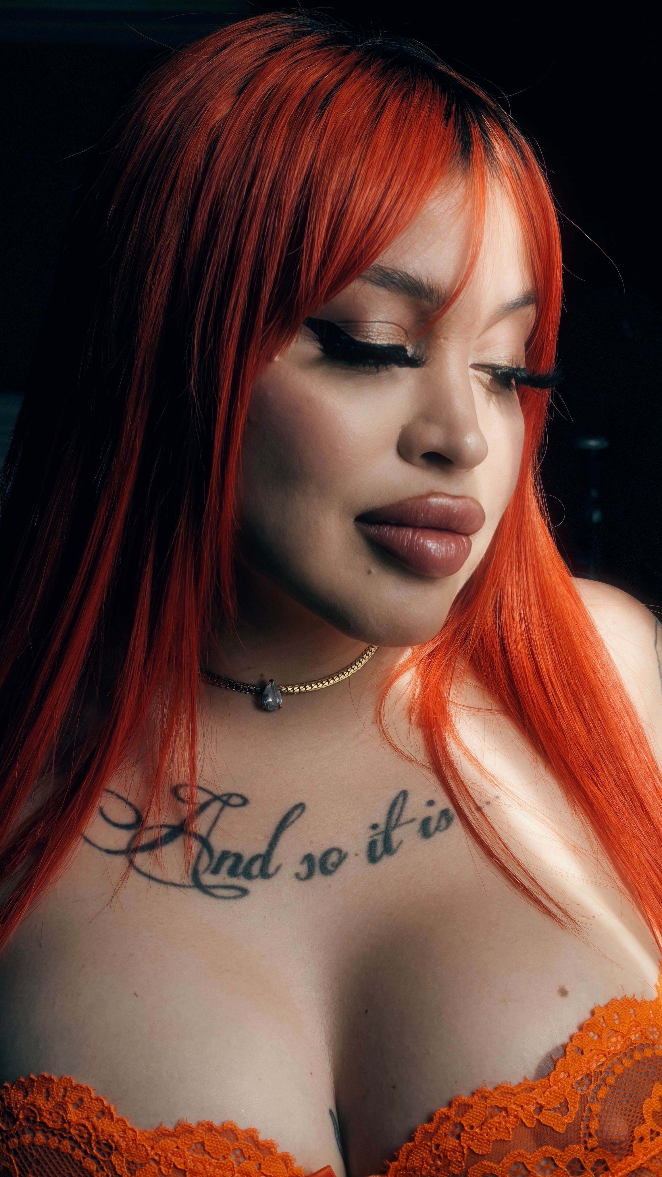 Portrait of Woman with Orange Hair and Tattoo