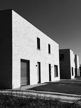 Stylish modern Belgian residential buildings showcased in black and white photography.