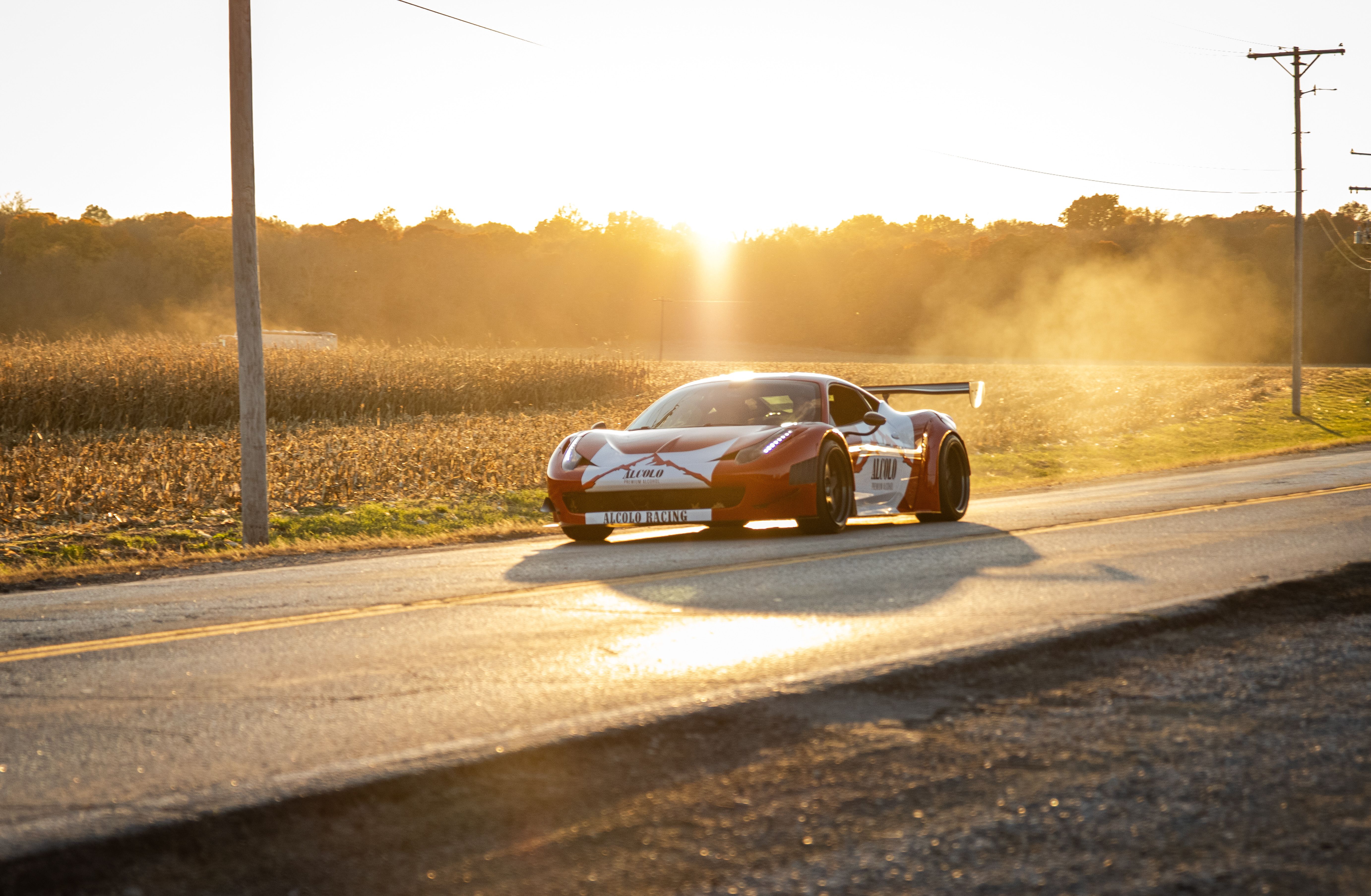 Dynamic Red Sports Car at Sunset in Kansas · Free Stock Photo