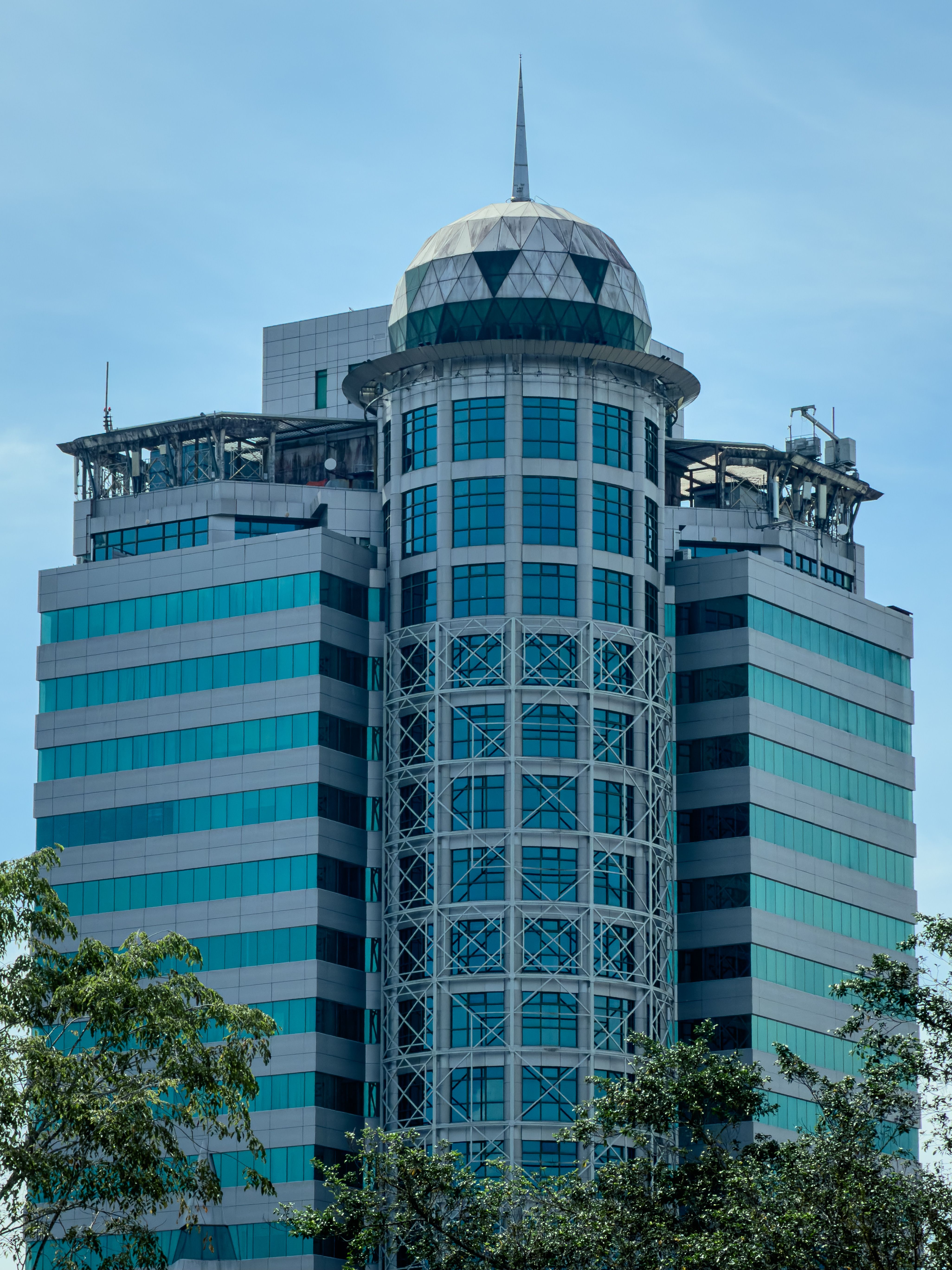 A striking skyscraper in Kuching, Sarawak, Malaysia with a unique dome design.