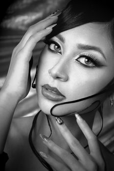Striking monochrome close-up portrait of a woman in Tlaxcala, México, with detailed makeup.