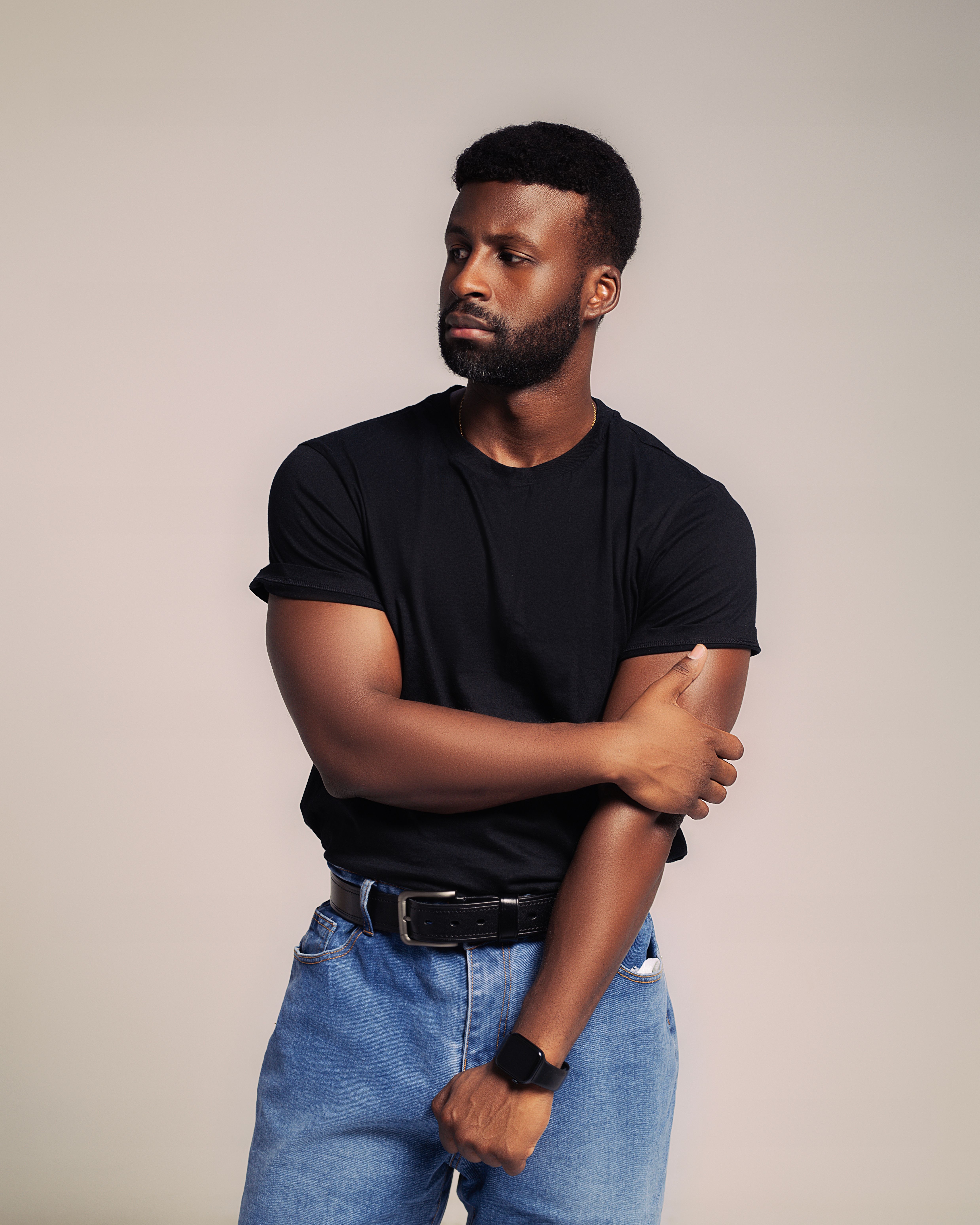 Fashionable Black Man in Casual Attire Posing Indoors  Free Stock Photo