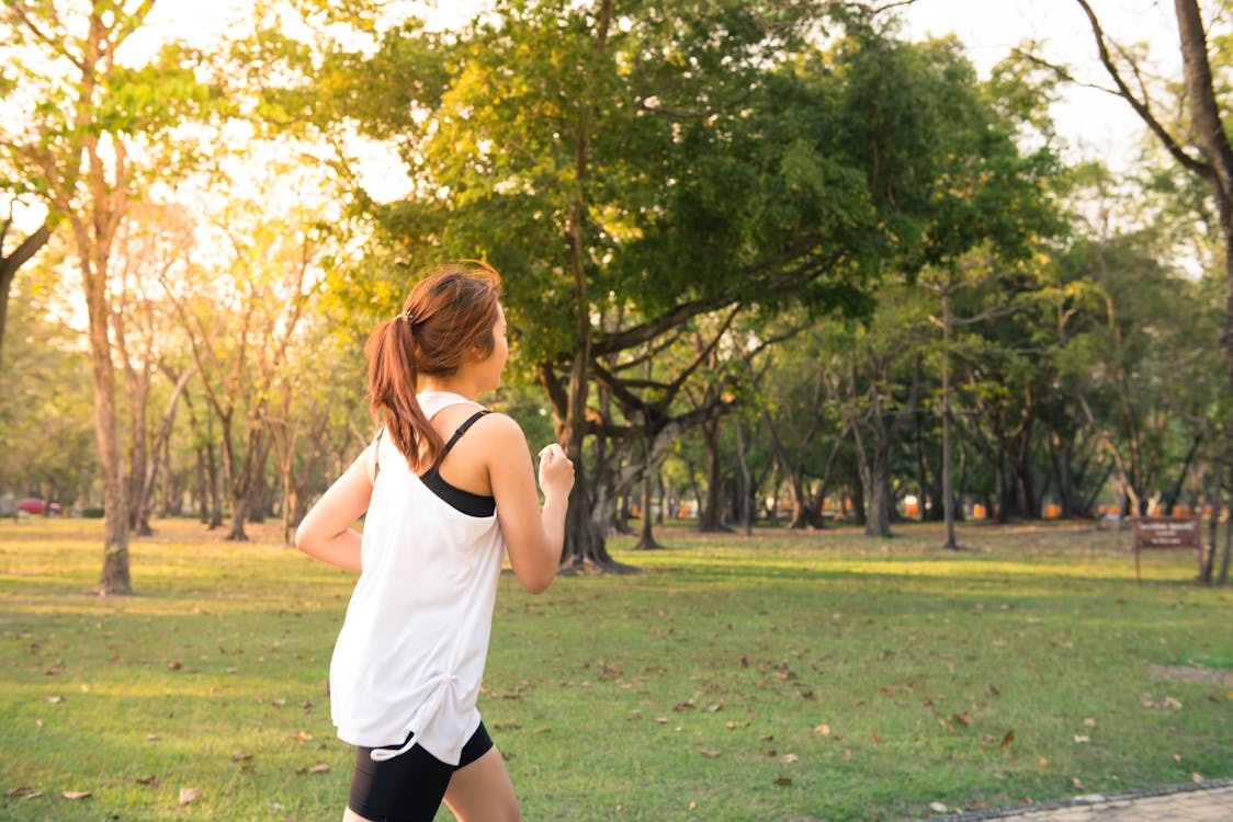 Free Woman About to Run during Golden Hour Stock Photo