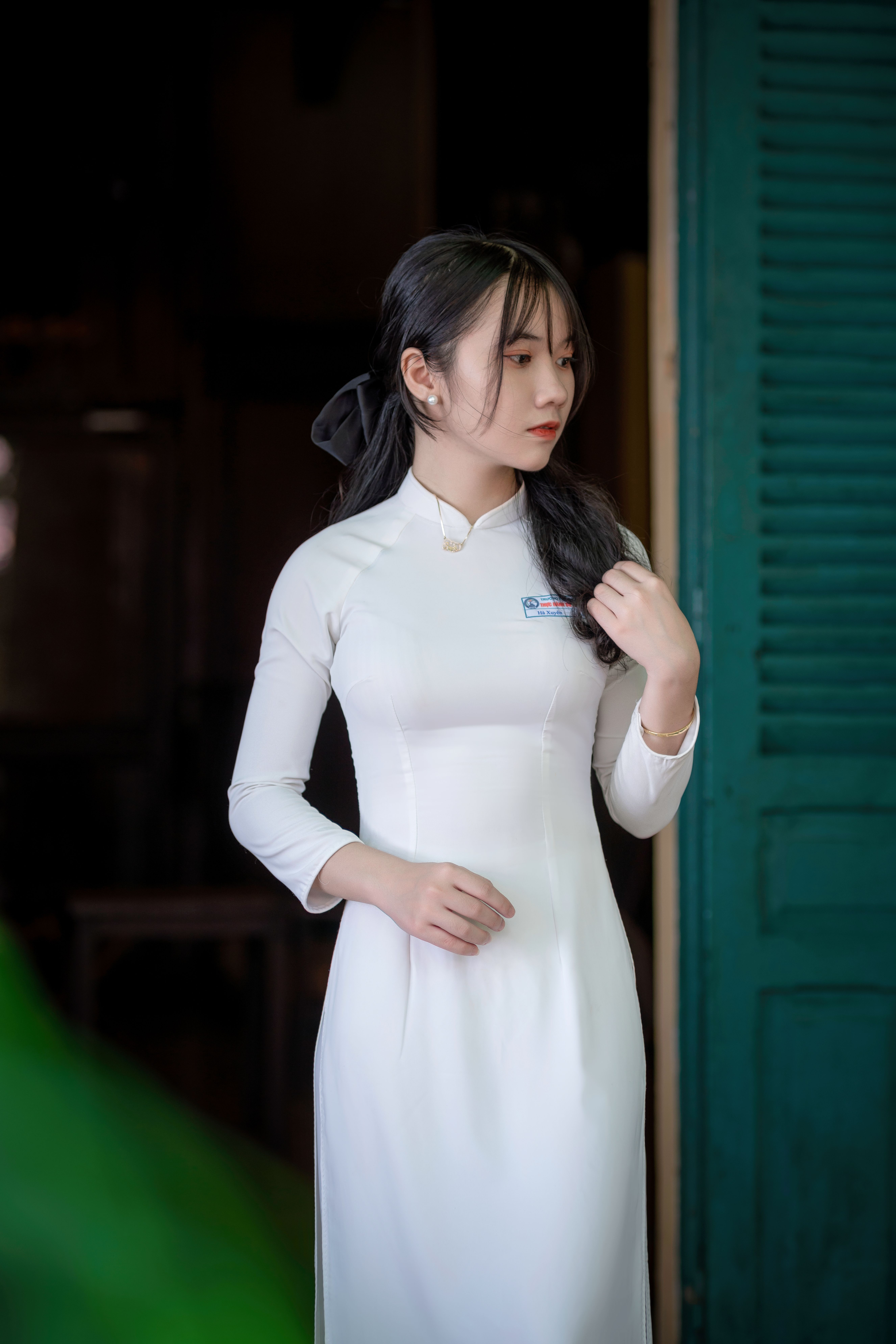 Elegant Woman in Traditional White Dress Indoors · Free Stock Photo