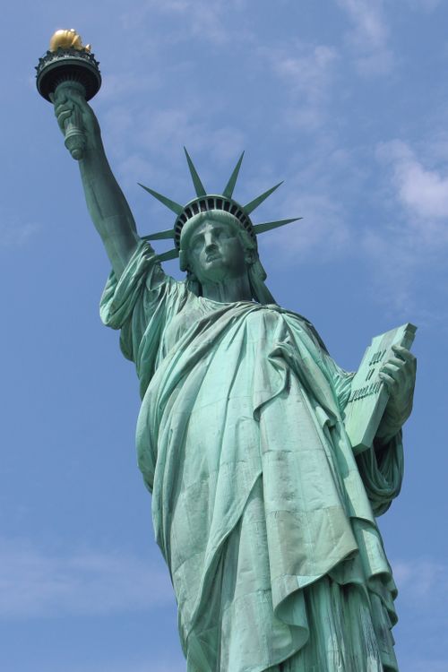 Free Close-up of the Statue of Liberty against a clear blue sky in New York City, USA. Stock Photo