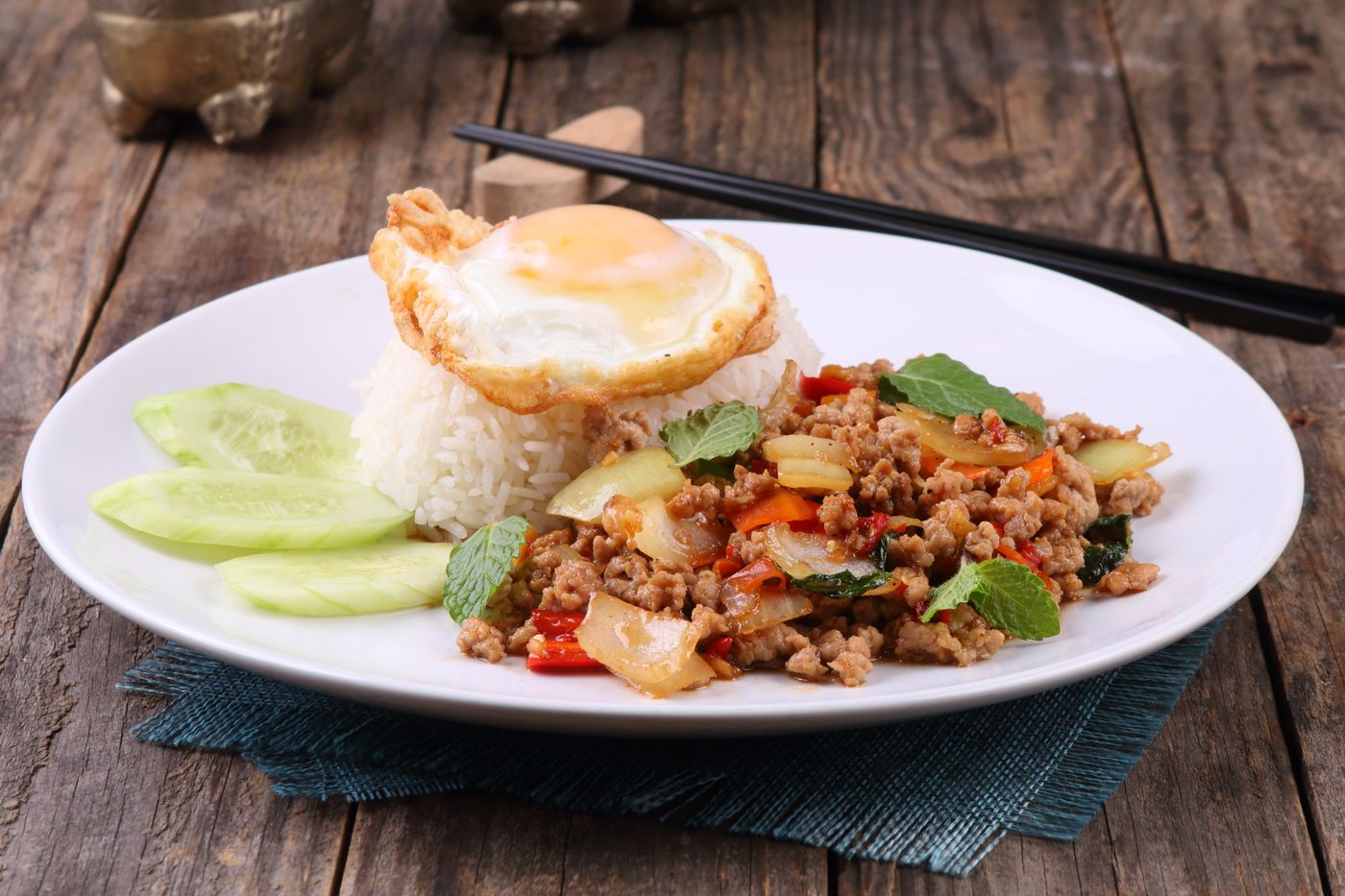 Savor the flavors of Thai basil beef stir-fry served with rice and a fried egg.