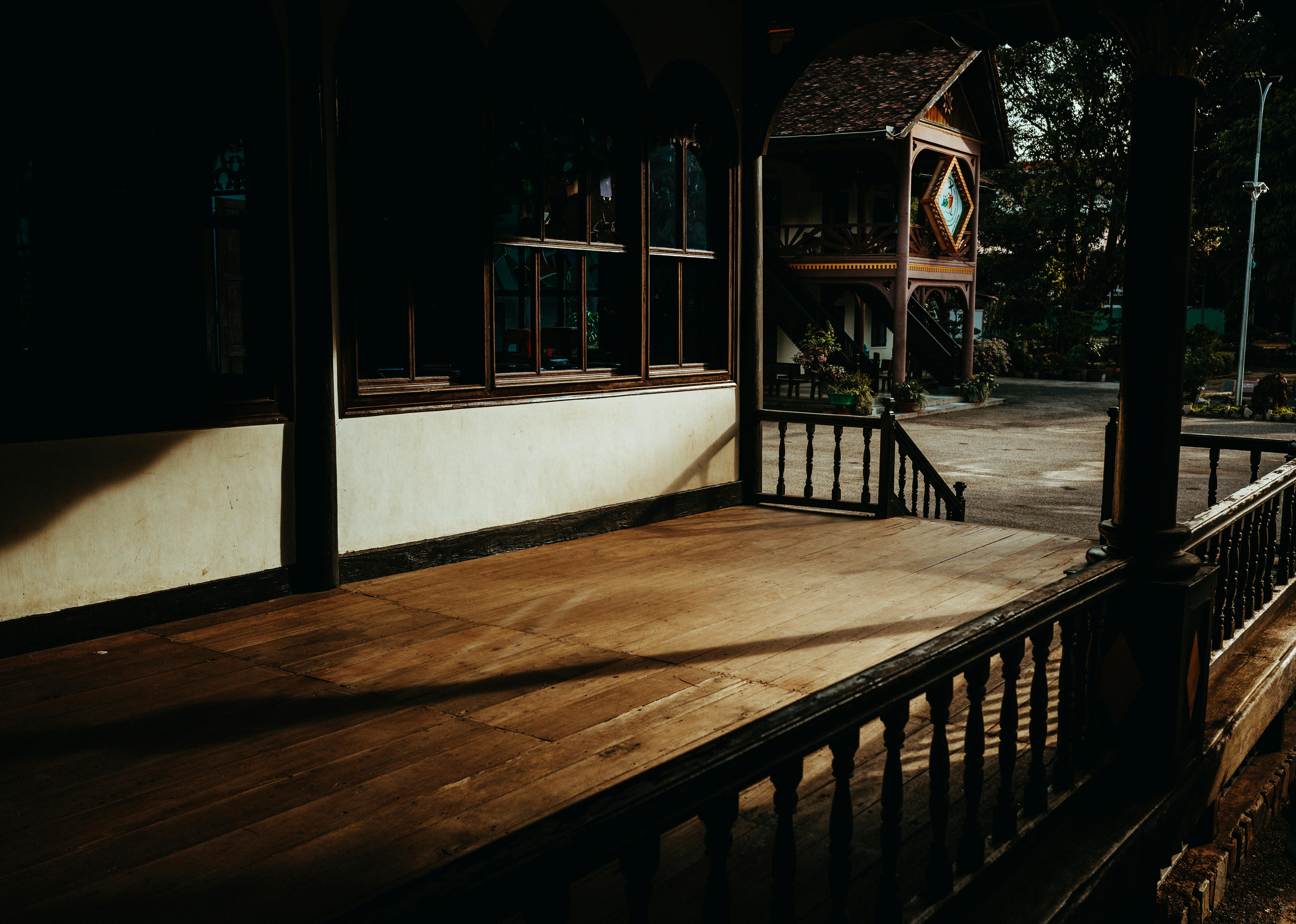 Free Capture of a traditional wooden house in Kon Tum, Vietnam, with warm natural lighting. Stock Photo