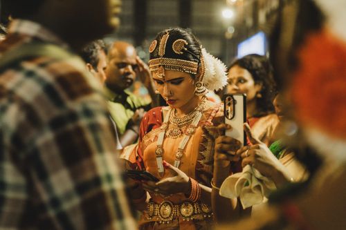 Free A woman in traditional attire at a vibrant Indian wedding ceremony in Guruvayur, Kerala. Stock Photo