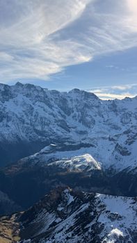 Breathtaking view of the Swiss Alps' snow-covered peaks in Lauterbrunnen, capturing winter's serene beauty.