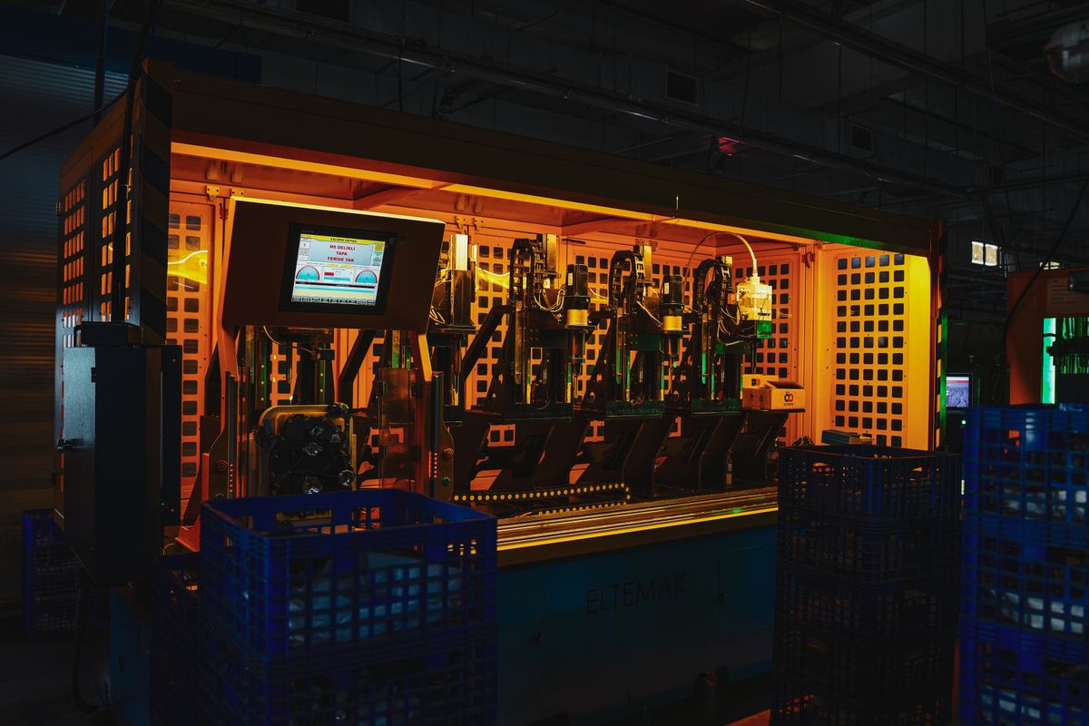 Industrial machinery inside a dimly lit manufacturing facility