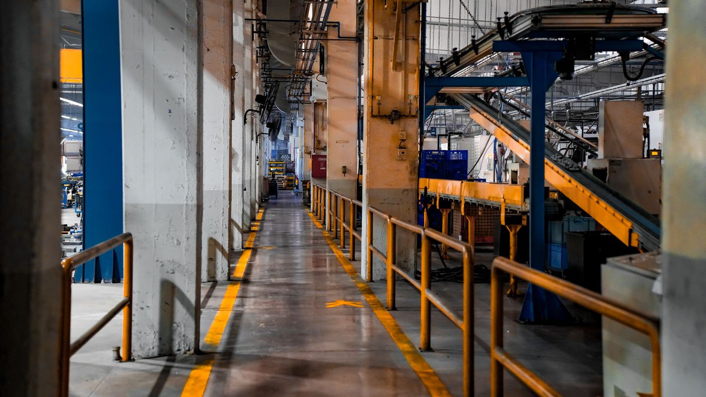 Clean, modern production floor with machinery and marked walkways
