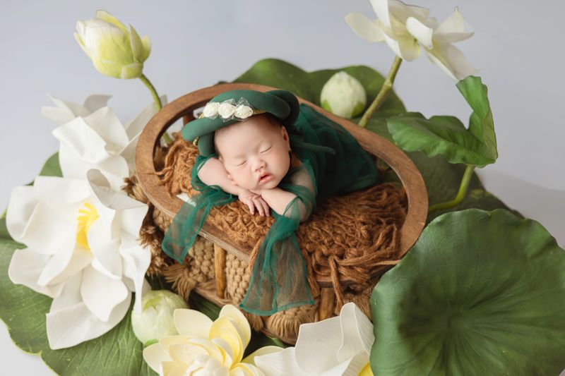 Newborn in lotus themed setup
