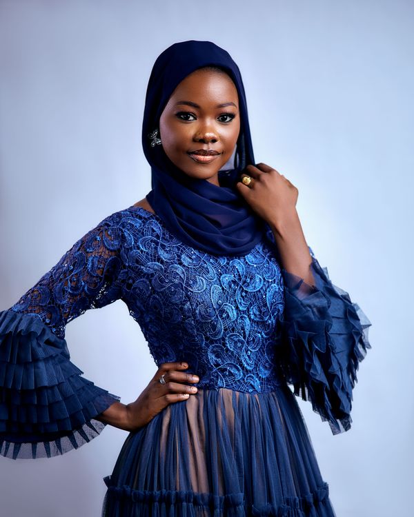 Woman wearing a navy lace midi dress