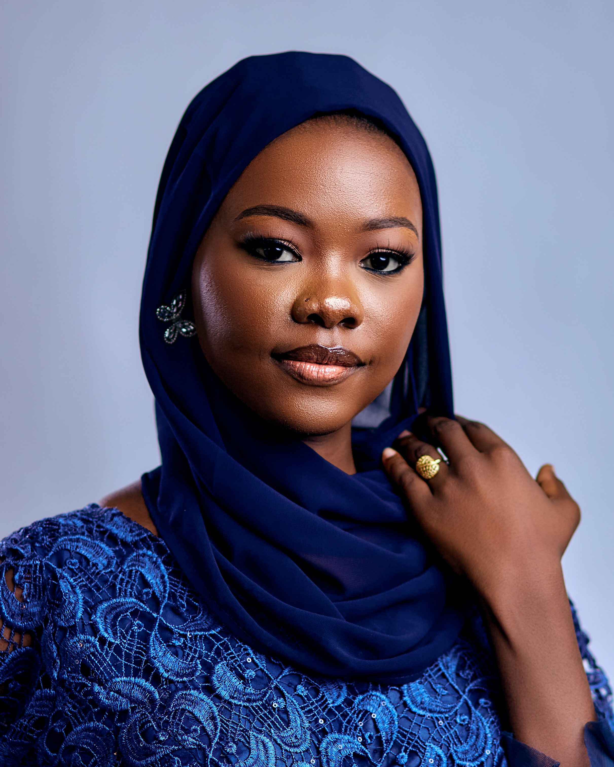 Elegant Portrait of a Woman in Blue Hijab · Free Stock Photo