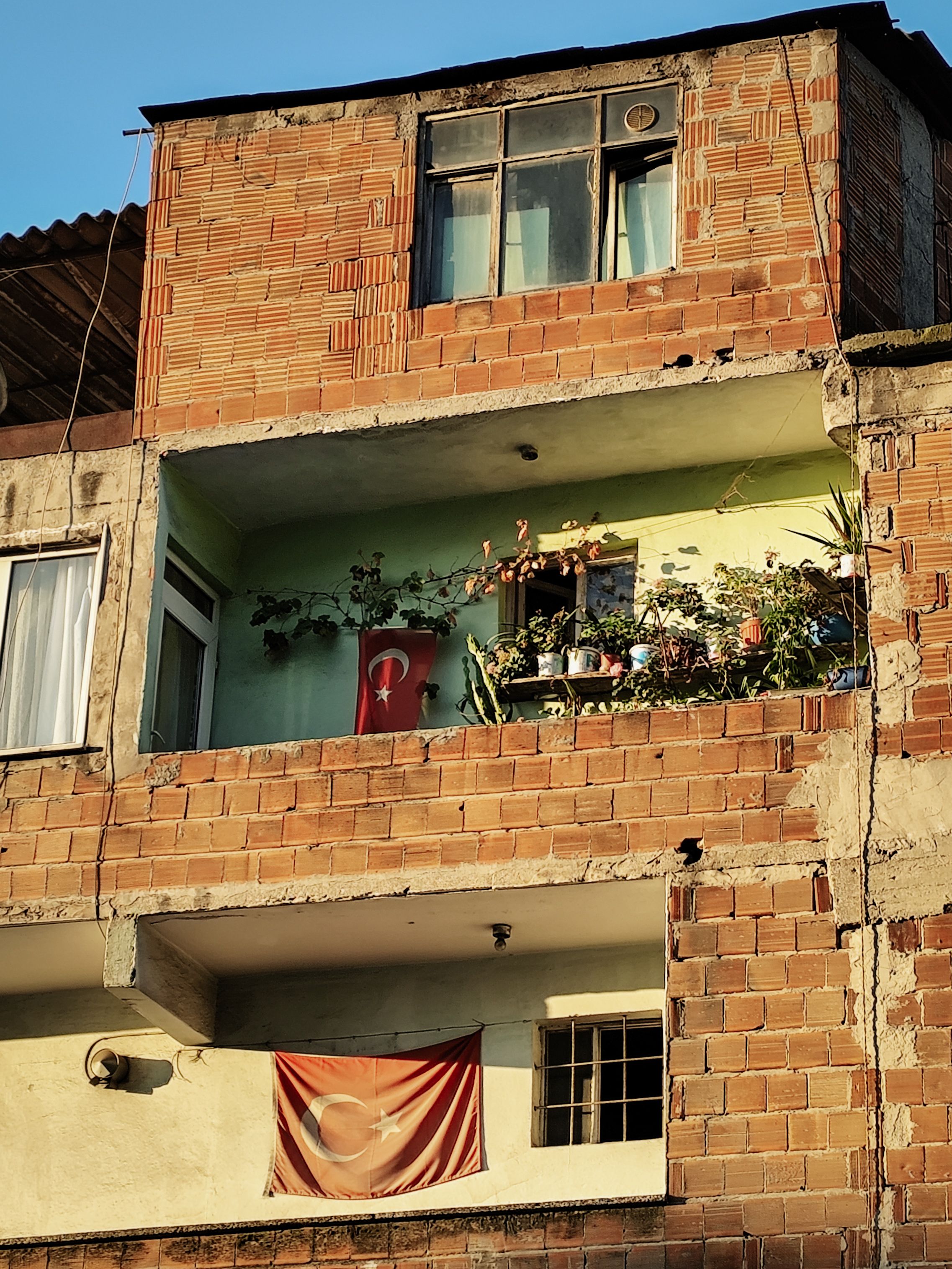Rustic Turkish Building with Flag and Balcony · Free Stock Photo