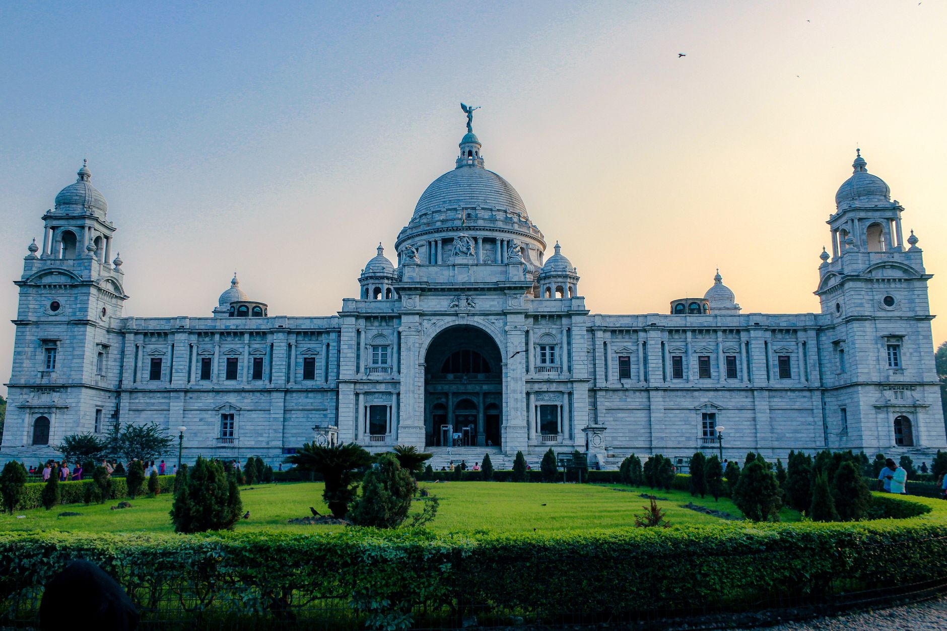 The stunning Victoria Memorial in Kolkata captured at dusk, showcasing its grand architecture.