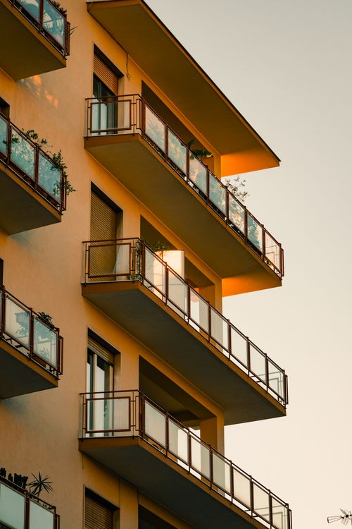 Modern Apartment Building at Sunset · Free Stock Photo