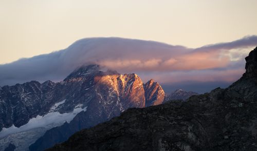 Free Dramatic sunrise lighting on the Italian Alps creates a breathtaking landscape scene. Stock Photo