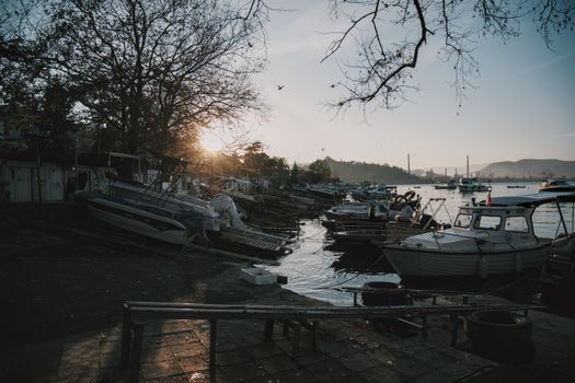 Captivating marina at sunset, featuring boats and serene water. Ideal for travel or lifestyle themes.