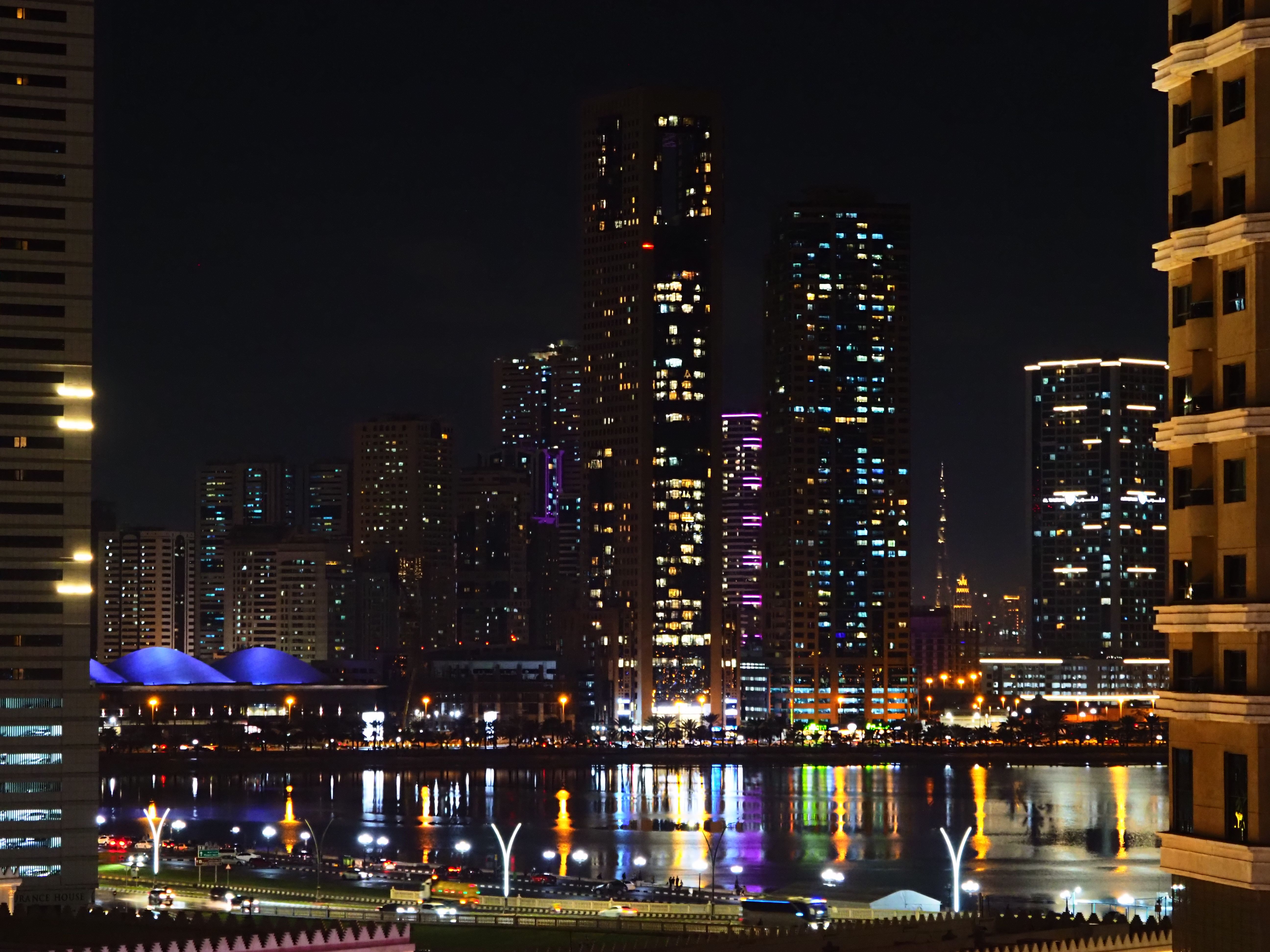 Vibrant Night Cityscape with Illuminated Skyscrapers · Free Stock Photo