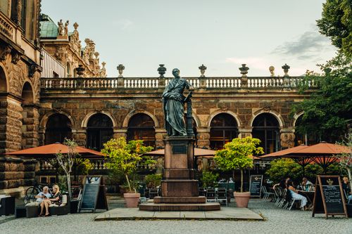 Free A stunning view of historic architecture and statue in the courtyard of Dresden Zwinger, Germany. Stock Photo