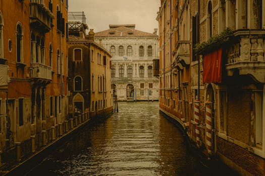 Vintage-styled view of a Venetian canal, capturing classic architecture in warm tones.