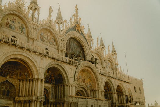 St. Mark's Basilica showcasing intricate Venetian architecture in summer light.