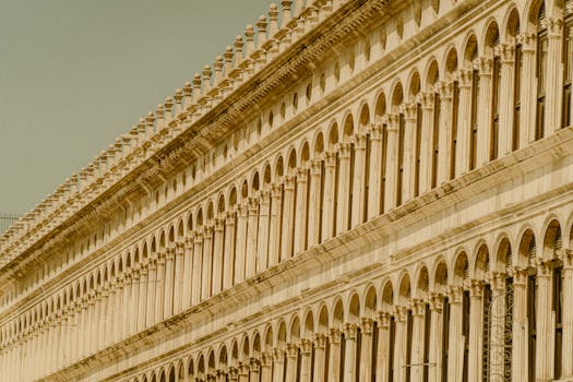 Elegant Venetian architecture featuring repetitive arches, showcasing Italian classic design in Venice.