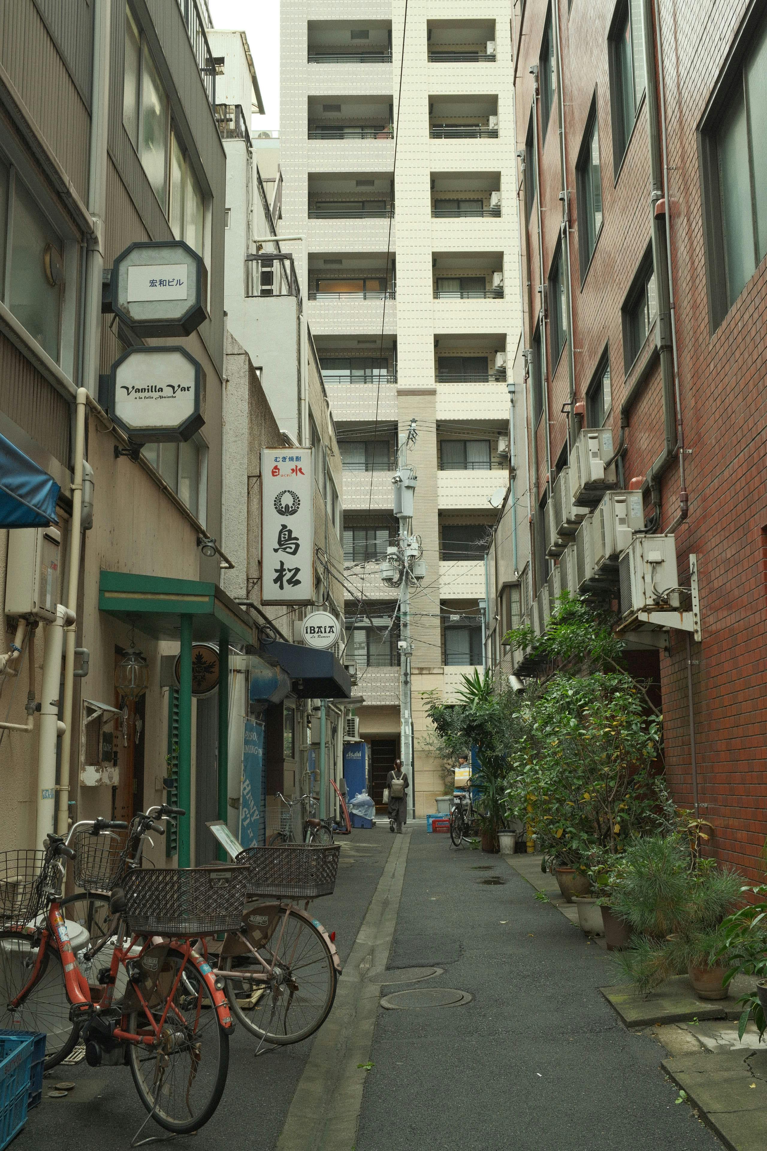 tokyo urban alley with bicycles and buildings