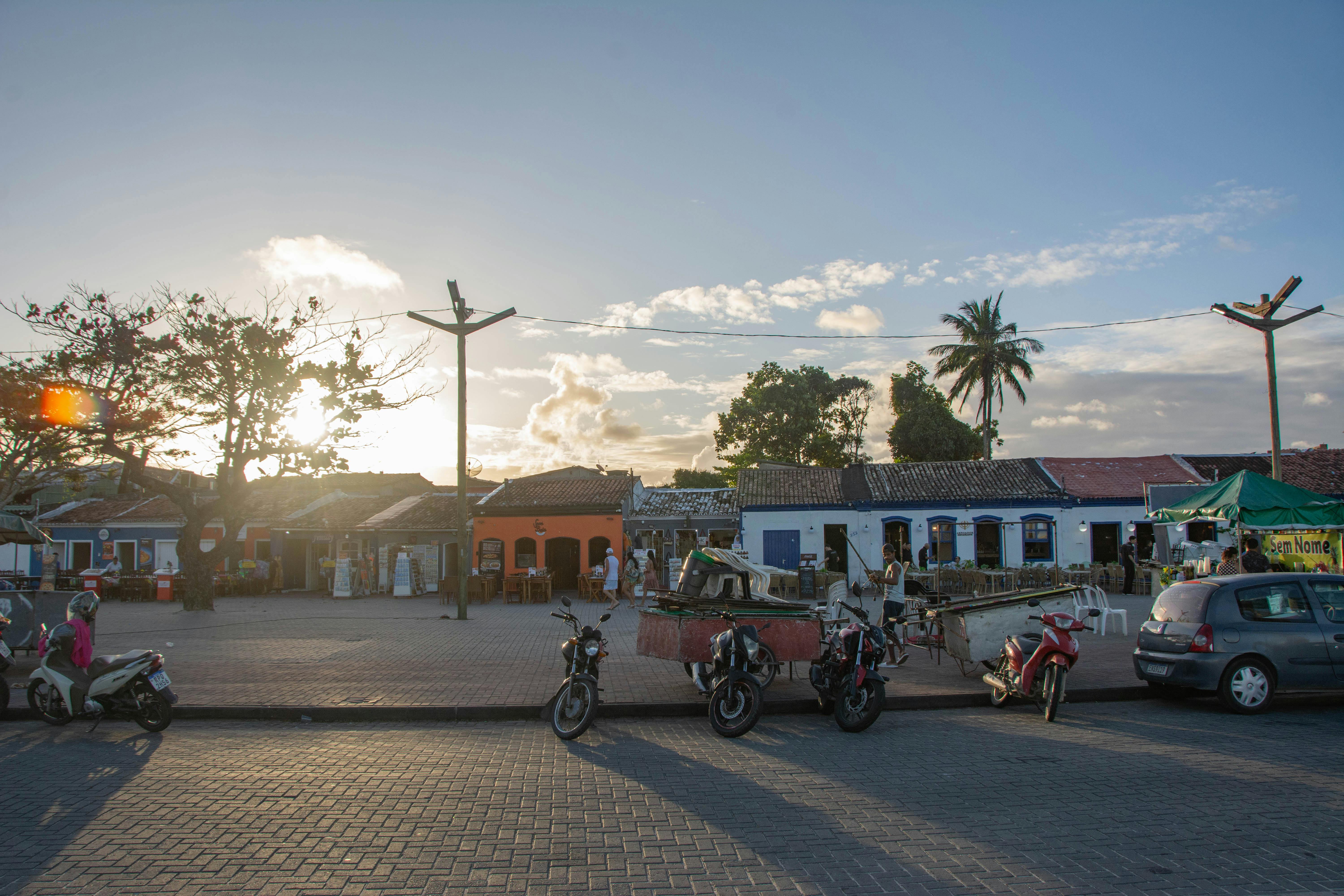 A scenic view of Porto Seguro, Brazil, featuring vintage architecture at sunset.