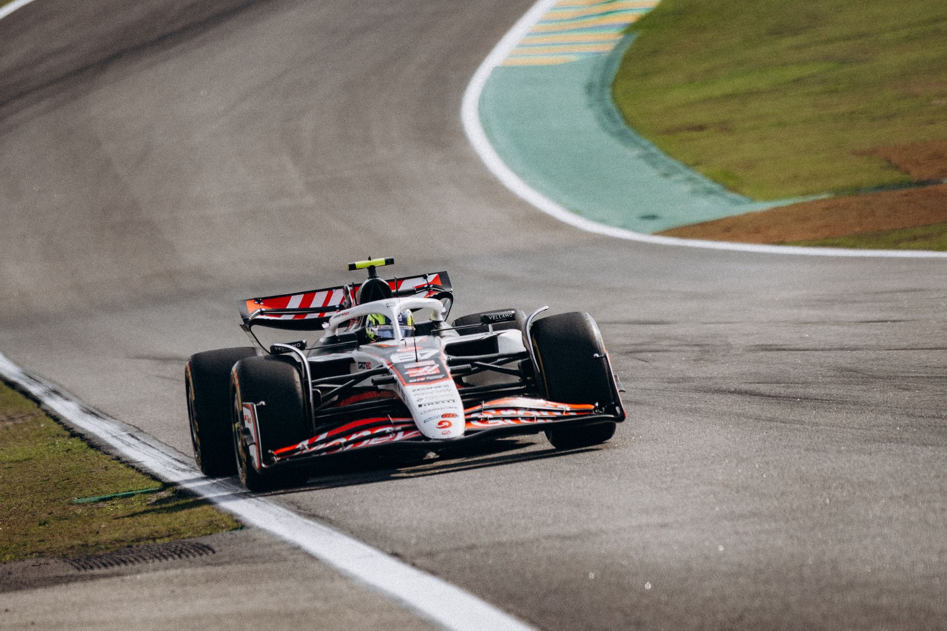Exciting shot of a Formula 1 car racing at Interlagos circuit in São Paulo, Brazil.