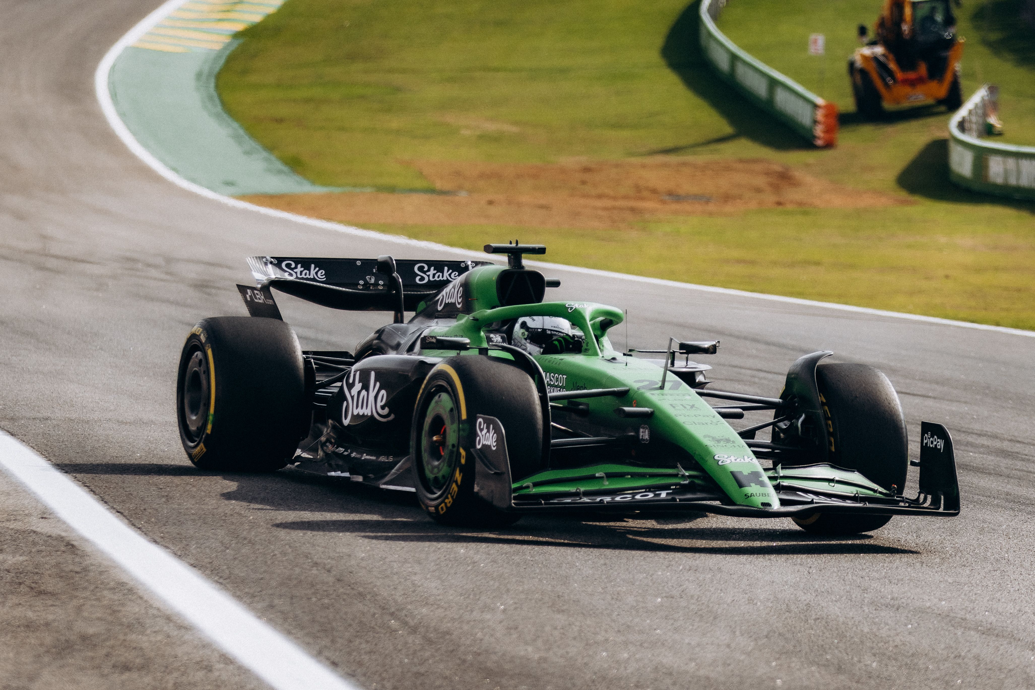 High-Speed Formula 1 Racing at Interlagos Track · Free Stock Photo